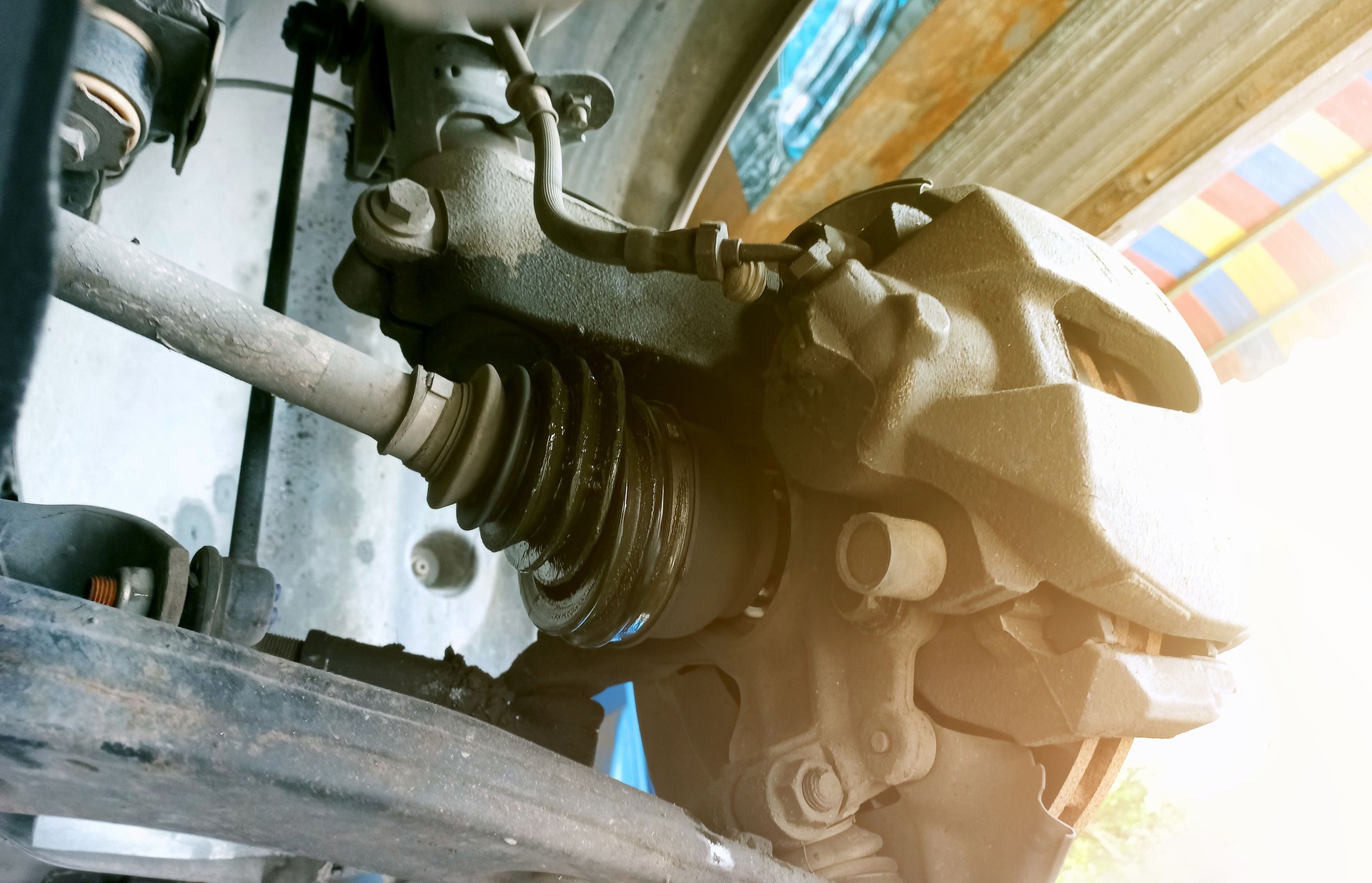 The drive axle is damaged. The rubber covering the axle is torn, affecting the vehicle's steering.